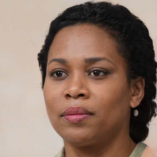 Neutral black young-adult female with medium  black hair and brown eyes