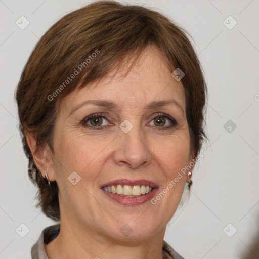 Joyful white adult female with medium  brown hair and grey eyes