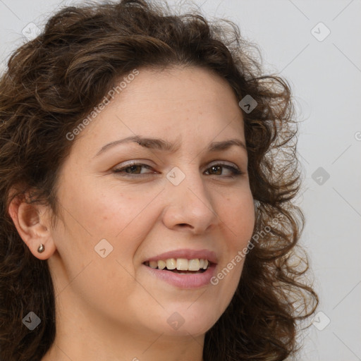 Joyful white adult female with long  brown hair and brown eyes