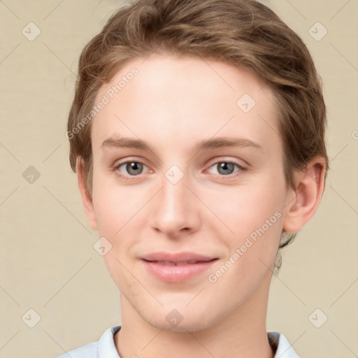 Joyful white young-adult female with short  brown hair and grey eyes