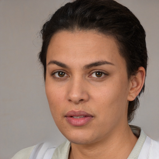 Joyful white young-adult female with short  brown hair and brown eyes