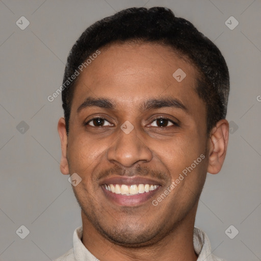 Joyful latino young-adult male with short  brown hair and brown eyes