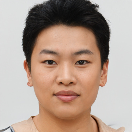 Joyful asian young-adult male with short  brown hair and brown eyes