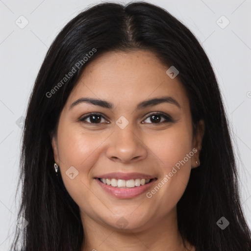 Joyful latino young-adult female with long  brown hair and brown eyes