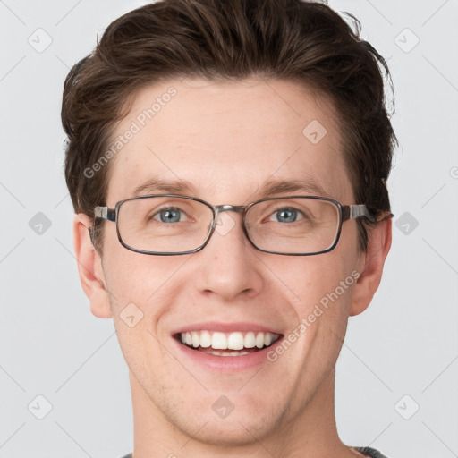 Joyful white adult male with short  brown hair and grey eyes