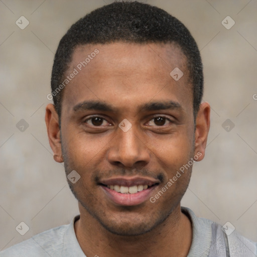 Joyful black young-adult male with short  black hair and brown eyes