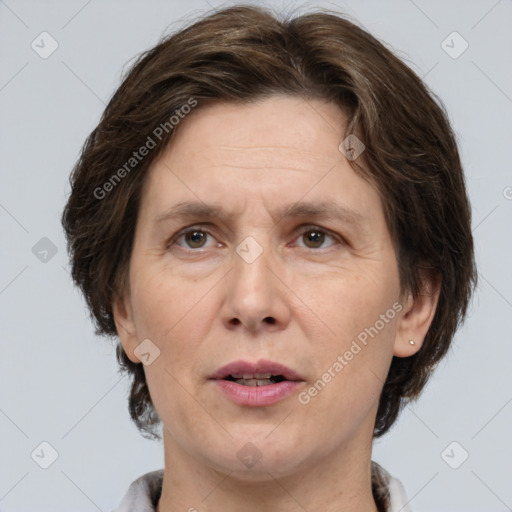 Joyful white adult female with medium  brown hair and brown eyes