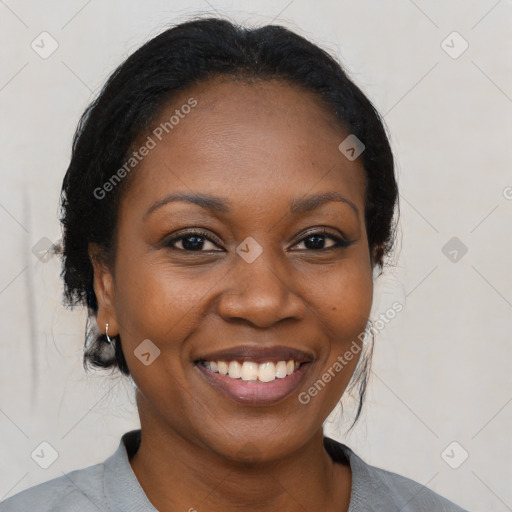 Joyful black young-adult female with medium  black hair and brown eyes