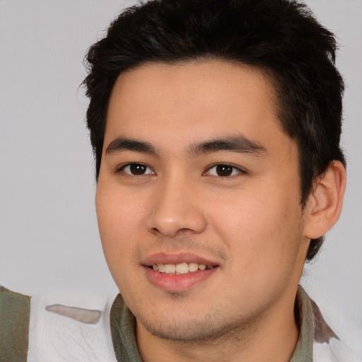 Joyful asian young-adult male with short  black hair and brown eyes