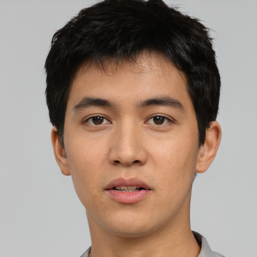 Neutral asian young-adult male with short  black hair and brown eyes