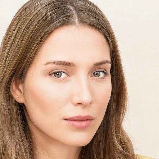 Neutral white young-adult female with long  brown hair and green eyes