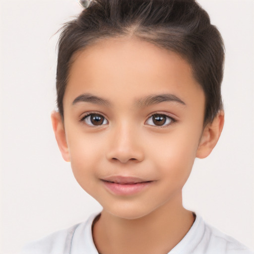 Joyful white child female with short  brown hair and brown eyes