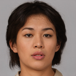 Neutral asian young-adult female with medium  brown hair and brown eyes