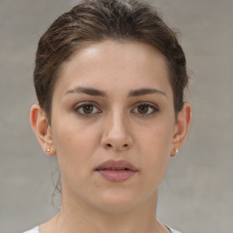 Neutral white young-adult female with short  brown hair and brown eyes