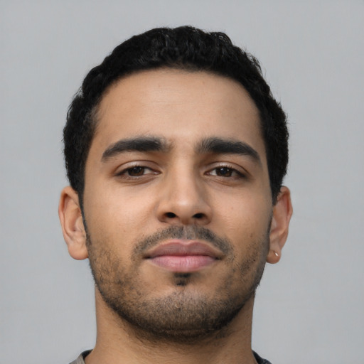 Neutral latino young-adult male with short  black hair and brown eyes