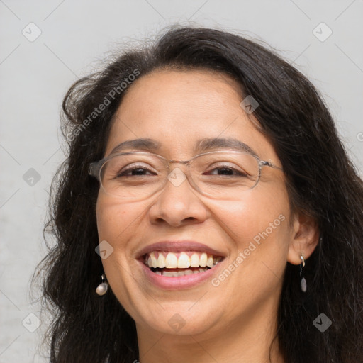 Joyful white adult female with long  brown hair and brown eyes