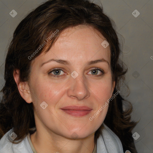 Joyful white adult female with medium  brown hair and blue eyes