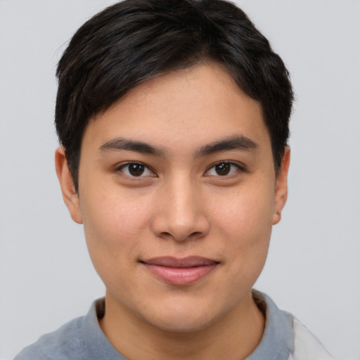 Joyful asian young-adult female with short  brown hair and brown eyes