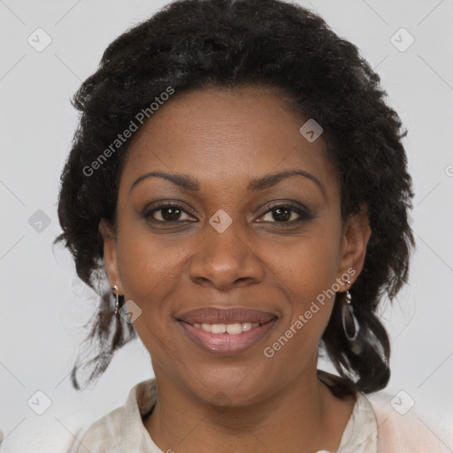 Joyful black adult female with medium  brown hair and brown eyes