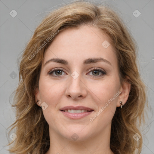 Joyful white young-adult female with medium  brown hair and green eyes