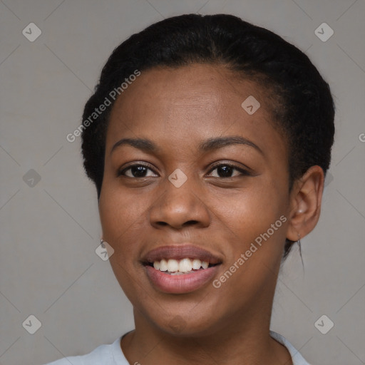 Joyful black young-adult female with short  black hair and brown eyes