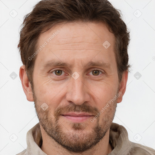 Joyful white adult male with short  brown hair and grey eyes