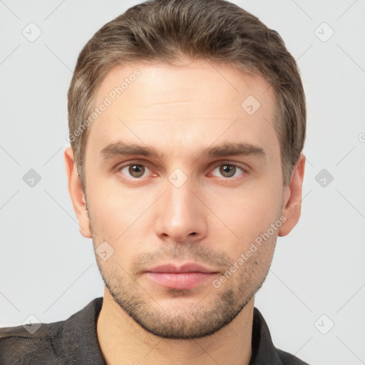 Neutral white young-adult male with short  brown hair and brown eyes