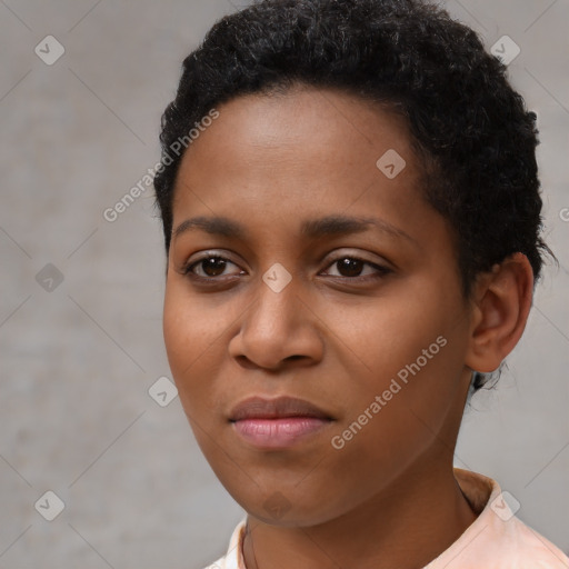 Joyful black young-adult female with short  black hair and brown eyes