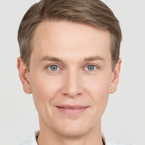 Joyful white adult male with short  brown hair and grey eyes