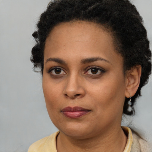 Neutral black young-adult female with short  brown hair and brown eyes
