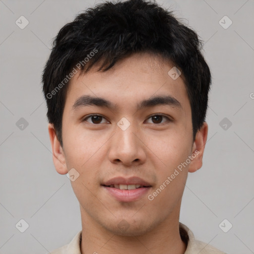 Joyful asian young-adult male with short  brown hair and brown eyes