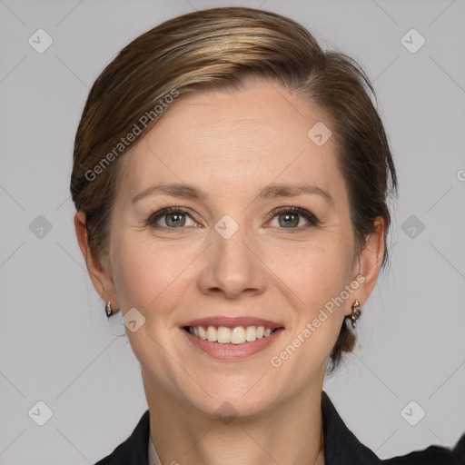 Joyful white adult female with medium  brown hair and grey eyes