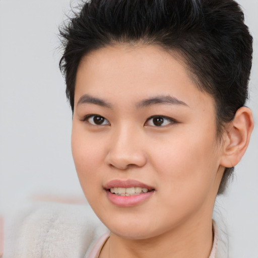 Joyful asian young-adult female with short  brown hair and brown eyes