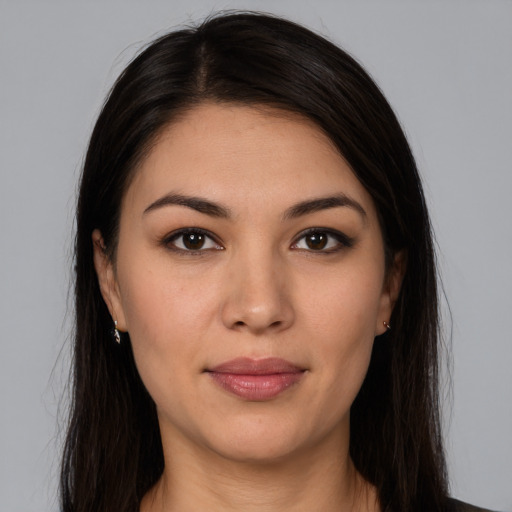 Joyful white young-adult female with long  brown hair and brown eyes