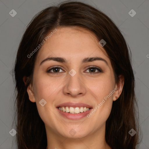 Joyful white young-adult female with long  brown hair and brown eyes