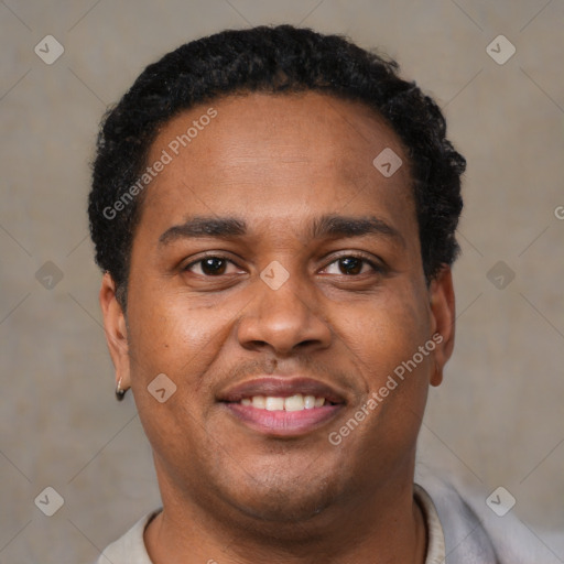 Joyful latino young-adult male with short  brown hair and brown eyes