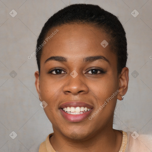 Joyful black young-adult female with short  brown hair and brown eyes