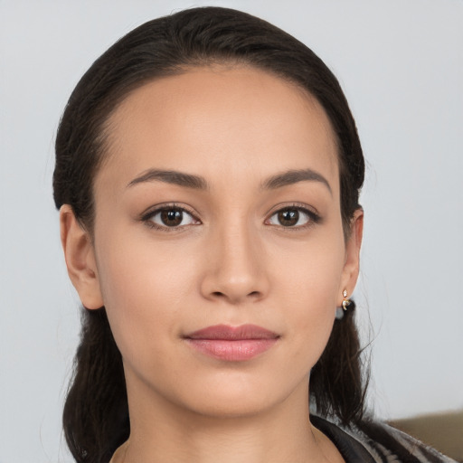 Joyful white young-adult female with long  brown hair and brown eyes