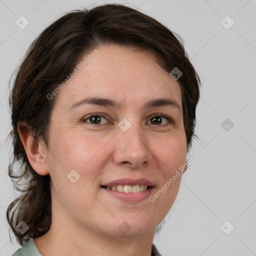 Joyful white adult female with medium  brown hair and grey eyes