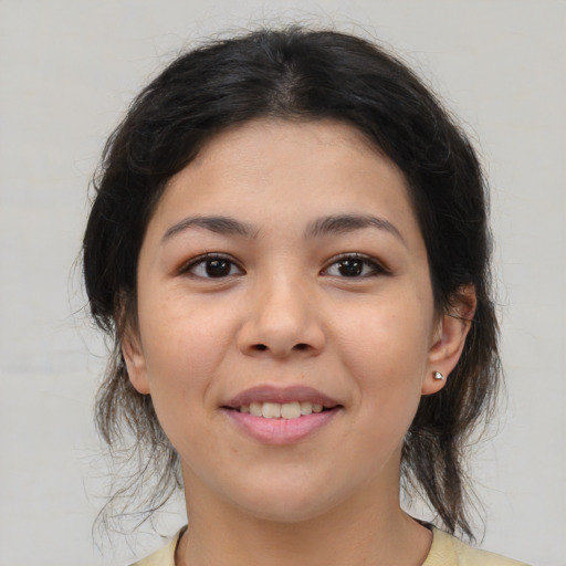 Joyful asian young-adult female with medium  brown hair and brown eyes