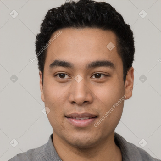 Joyful latino young-adult male with short  black hair and brown eyes