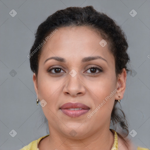 Joyful latino adult female with short  brown hair and brown eyes