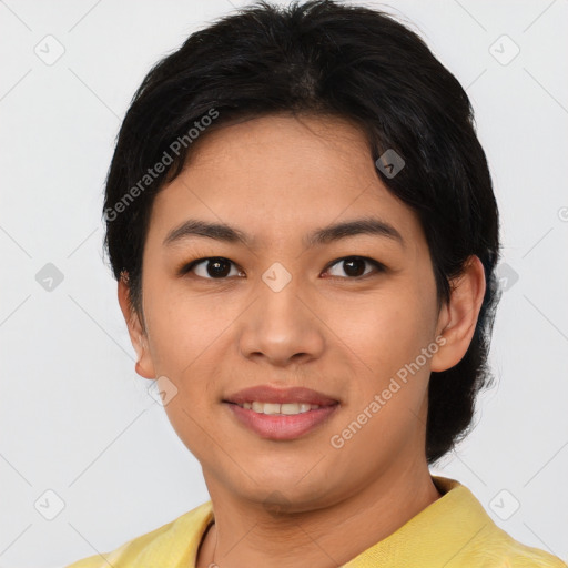 Joyful asian young-adult female with short  black hair and brown eyes