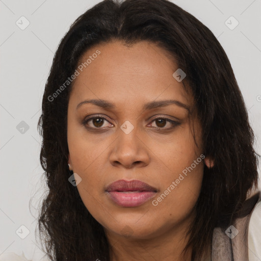 Joyful black young-adult female with long  brown hair and brown eyes