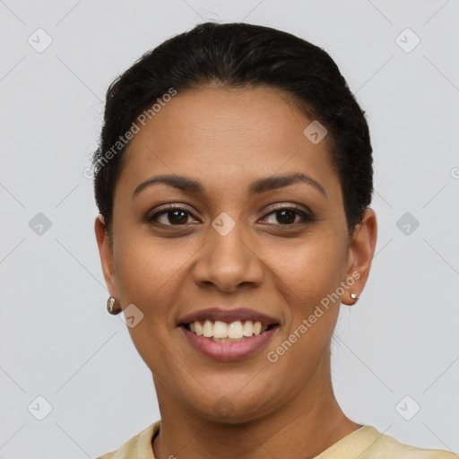 Joyful latino young-adult female with short  brown hair and brown eyes