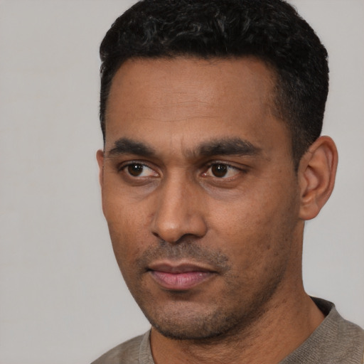 Neutral latino young-adult male with short  black hair and brown eyes