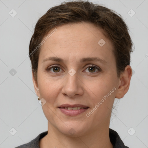 Joyful white adult female with short  brown hair and grey eyes