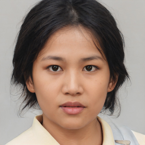 Neutral asian young-adult female with medium  brown hair and brown eyes