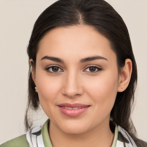 Joyful white young-adult female with medium  brown hair and brown eyes