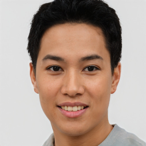 Joyful asian young-adult male with short  black hair and brown eyes